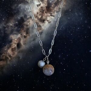 Elegant Silver Tone Necklace with Dual Pendants Earth and Moon.